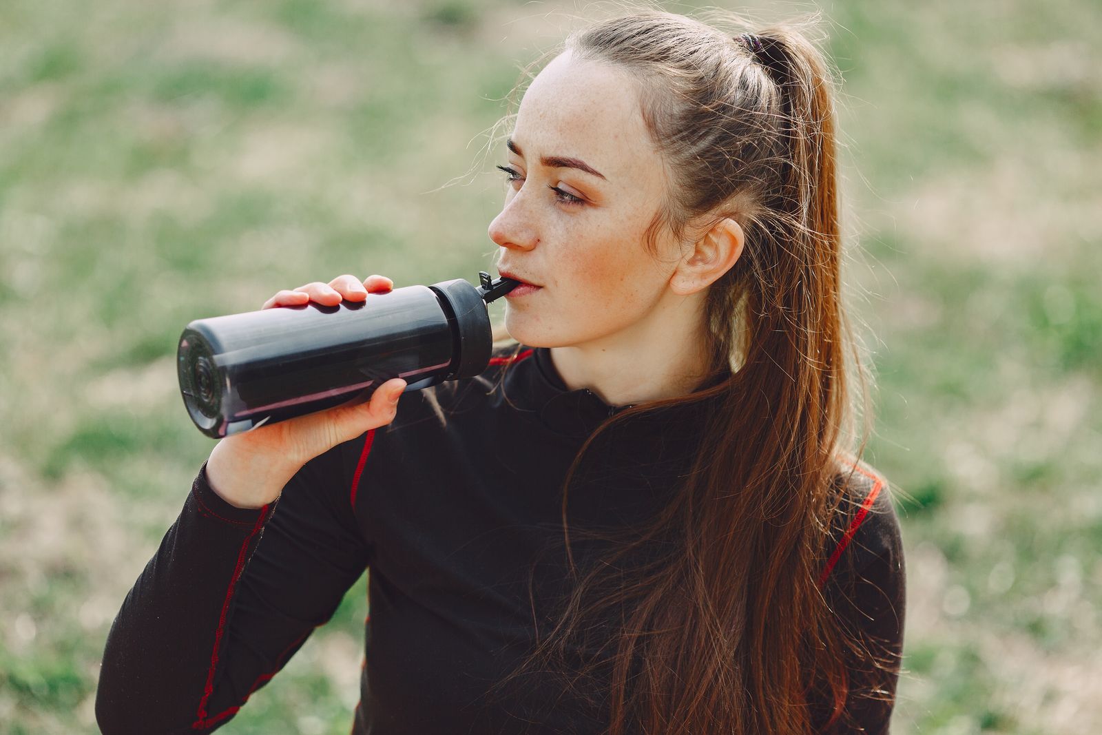 An outdoor fitness moment with a water bottle, illustrating a sample campaign